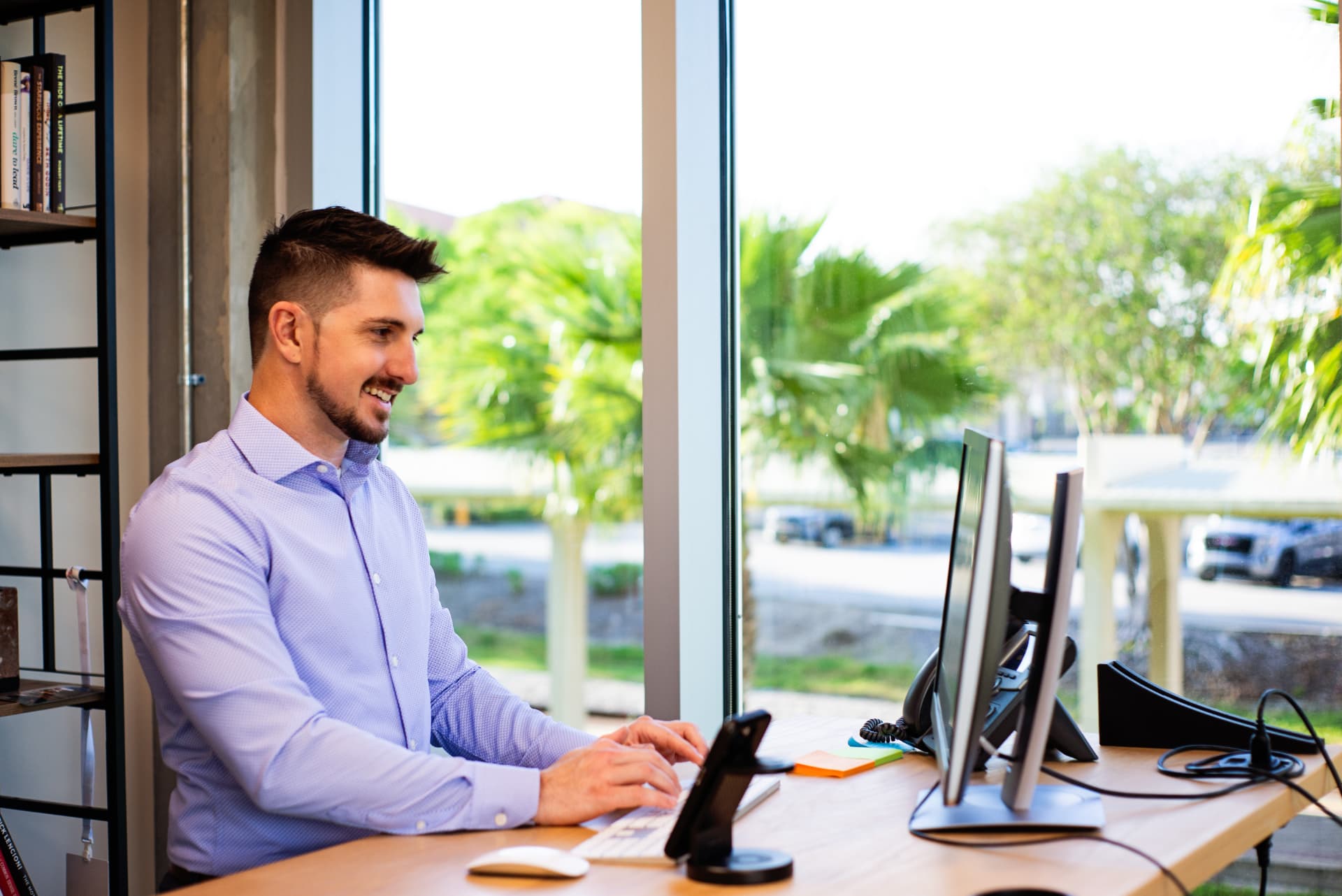 Adam Whelchel working at his desk in the Axis office